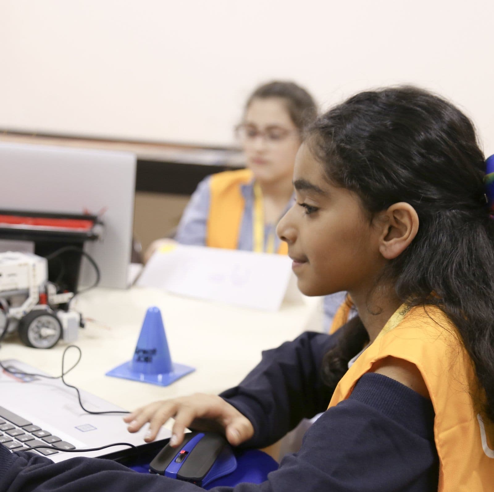 Girls working through a hands-on STEMania activity