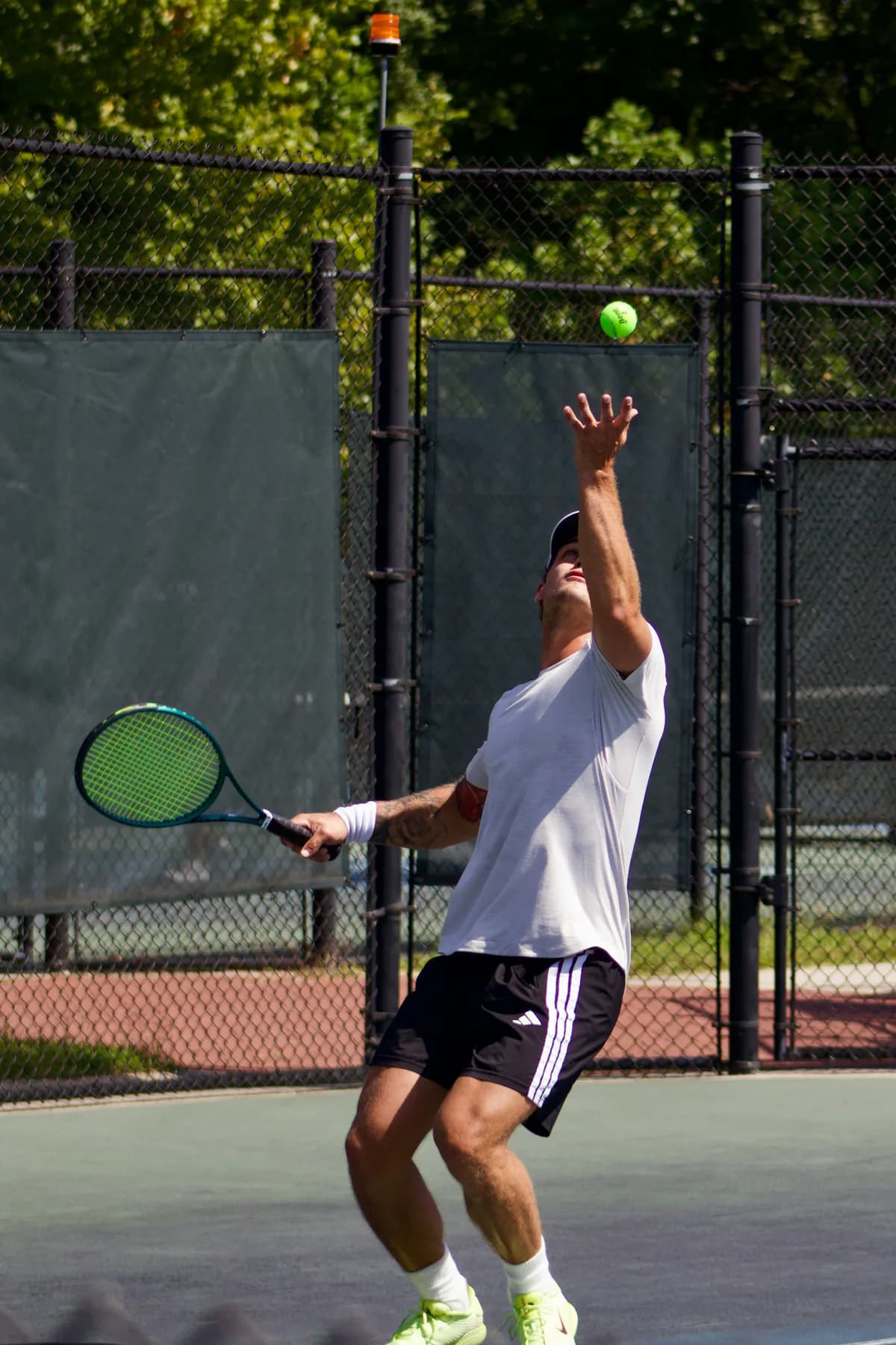 Tennis in a palm-lined destination